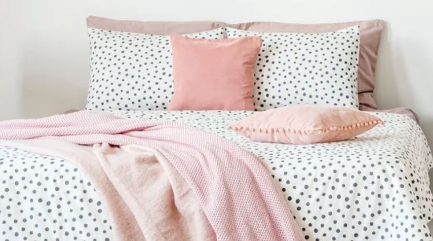 Pink pillow and blanket accents